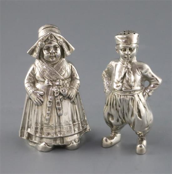 A pair of late 19th century Hanau silver figural pepperettes, 9.5 oz.